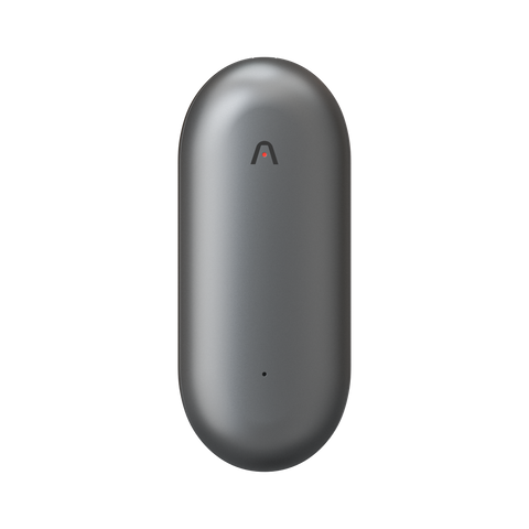 The Plaud NotePin is an innovative wearable note taker featuring a sleek, oval-shaped metallic gray design with a subtle logo at the top and a discreet LED indicator near the bottom, all showcased on a white background. This device seamlessly combines minimalist aesthetics with advanced functionality.