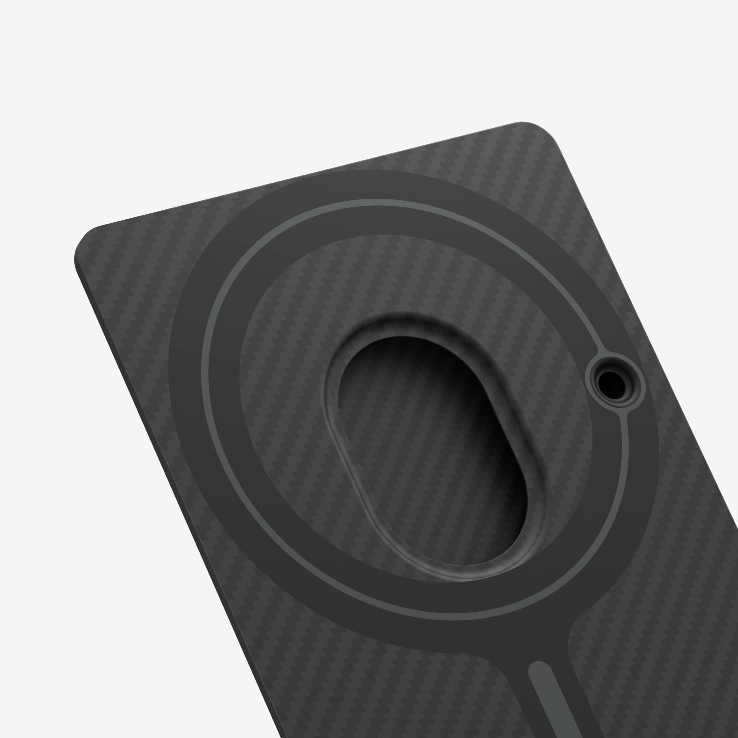 Close-up of the carbon fiber finish and magnetic ring on the back of the Plaud Note Pro.