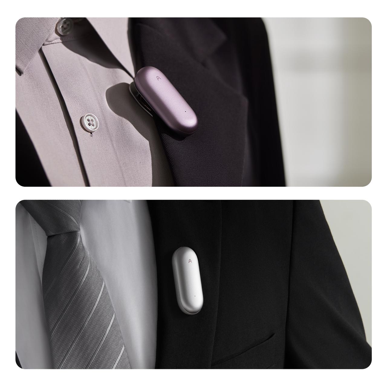 Purple and silver Plaud NotePin AI voice recorders clipped to professional suit jackets and shirts.