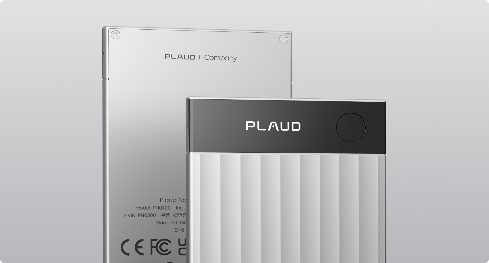 Front and back views of the silver Plaud Note AI voice recorder showing its slim, textured design.