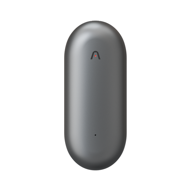 The Plaud NotePin is an innovative wearable note taker featuring a sleek, oval-shaped metallic gray design with a subtle logo at the top and a discreet LED indicator near the bottom, all showcased on a white background. This device seamlessly combines minimalist aesthetics with advanced functionality.