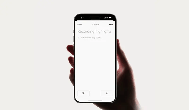 Hand holding a smartphone showing the PLAUD app interface for recording highlights and taking notes.