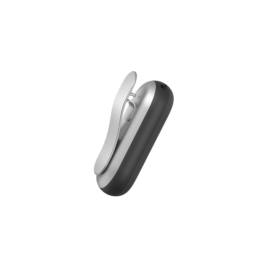Plaud NotePin AI voice recorder in silver and black, shown from the side with its wearable clip accessory attached.