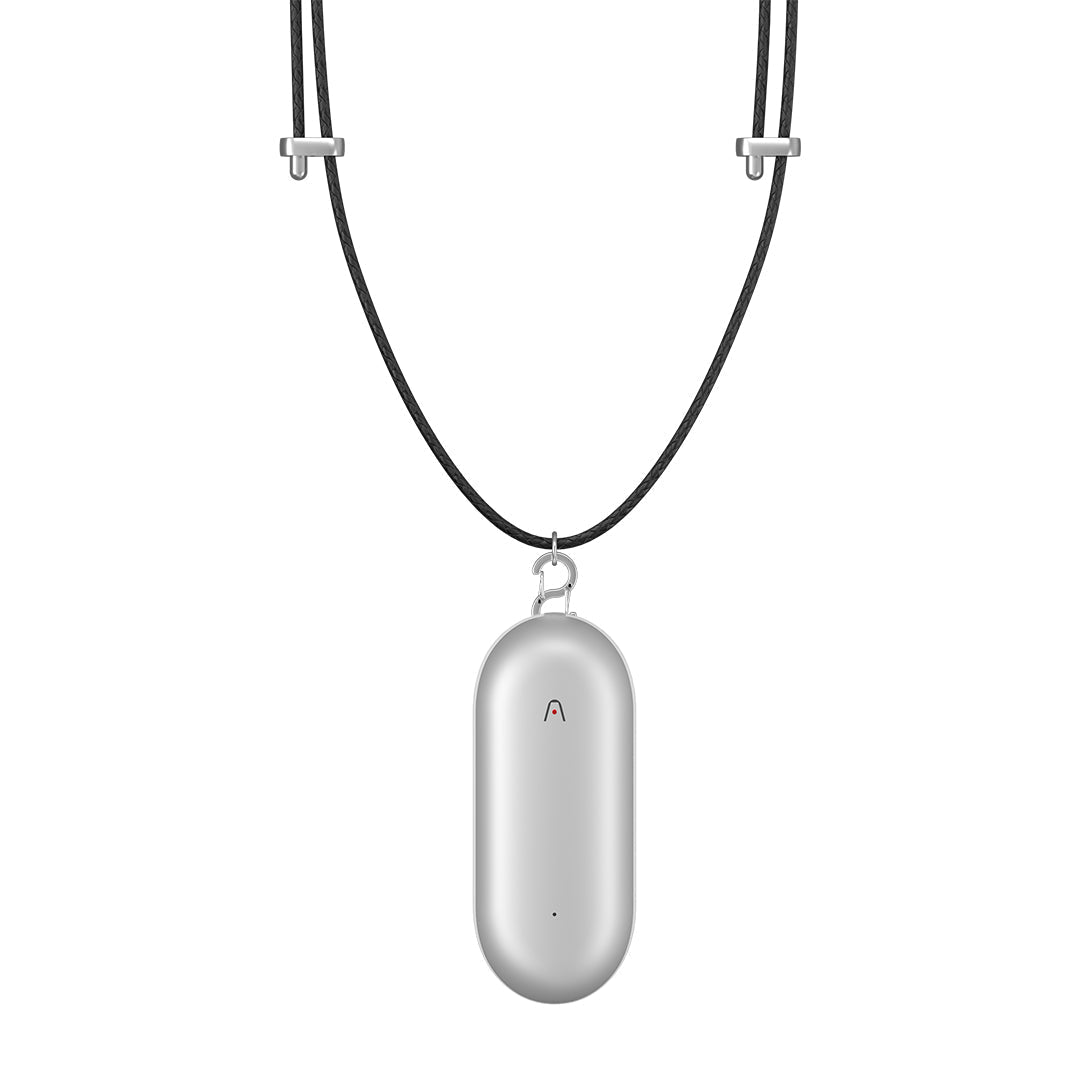 Silver PLAUD NotePin AI voice recorder attached to a black lanyard necklace.