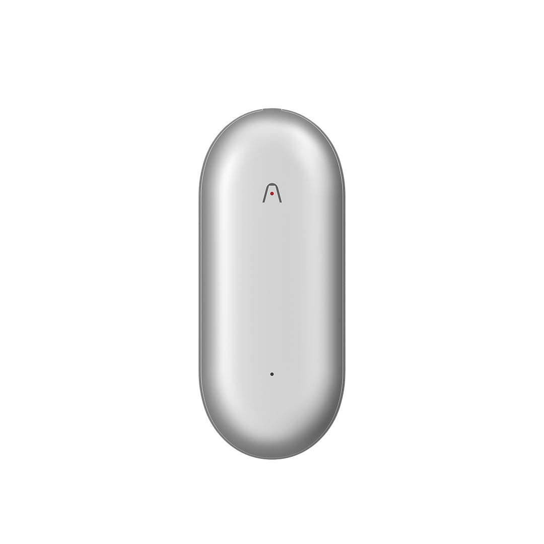 Silver Plaud NotePin AI voice recorder with a pill-shaped design and recording indicator light.
