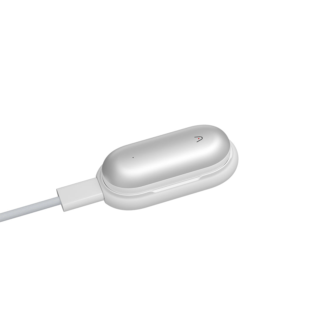 Silver PLAUD NotePin AI voice recorder charging in its white magnetic dock.